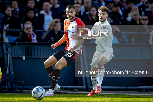 Feyenoord Rotterdam defender David Hancko and FC Twente forward Mitchell van Bergen play during the match between Feyenoord and Twente at th...