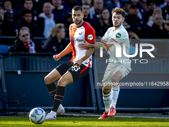 Feyenoord Rotterdam defender David Hancko and FC Twente forward Mitchell van Bergen play during the match between Feyenoord and Twente at th...