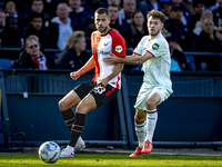 Feyenoord Rotterdam defender David Hancko and FC Twente forward Mitchell van Bergen play during the match between Feyenoord and Twente at th...