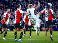 Feyenoord Rotterdam defender Thomas Beelen, FC Twente midfielder Sem Steijn, and Feyenoord Rotterdam defender Jordan Lotomba participate dur...