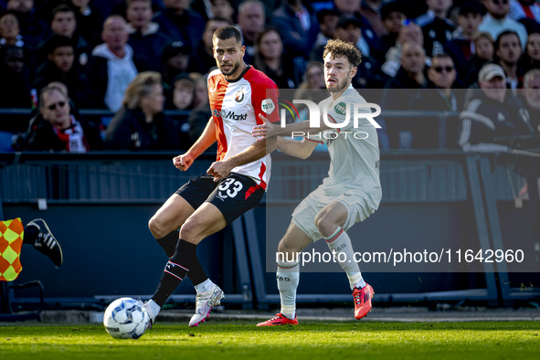 Feyenoord Rotterdam defender David Hancko and FC Twente forward Mitchell van Bergen play during the match between Feyenoord and Twente at th...