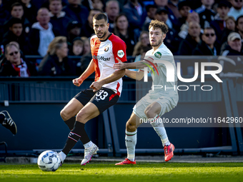 Feyenoord Rotterdam defender David Hancko and FC Twente forward Mitchell van Bergen play during the match between Feyenoord and Twente at th...