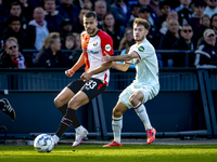 Feyenoord Rotterdam defender David Hancko and FC Twente forward Mitchell van Bergen play during the match between Feyenoord and Twente at th...