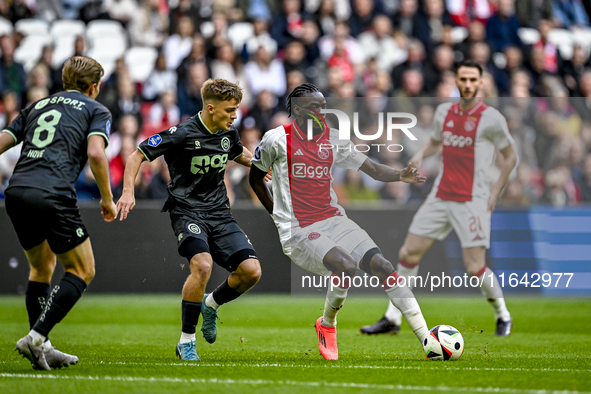 FC Groningen defender Wouter Prins and AFC Ajax Amsterdam forward Bertrand Traore play during the match Ajax vs. Groningen at the Johan Crui...