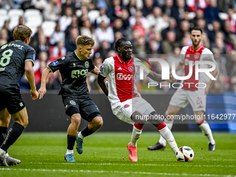 FC Groningen defender Wouter Prins and AFC Ajax Amsterdam forward Bertrand Traore play during the match Ajax vs. Groningen at the Johan Crui...