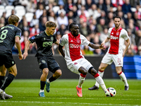 FC Groningen defender Wouter Prins and AFC Ajax Amsterdam forward Bertrand Traore play during the match Ajax vs. Groningen at the Johan Crui...