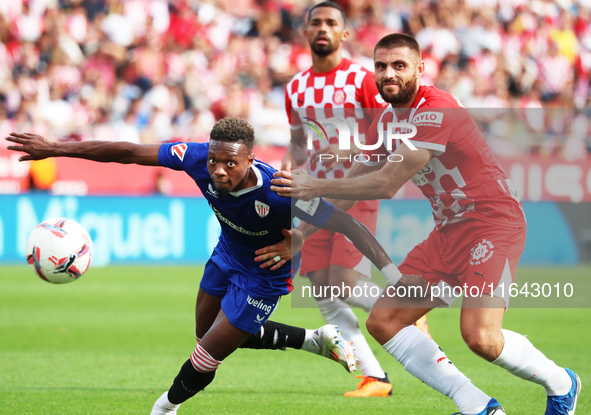 David Lopez and Alvaro Djalo play during the match between Girona FC and Athletic Club, corresponding to week 9 of LaLiga EA Sport, at the M...