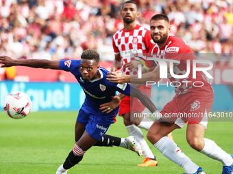 David Lopez and Alvaro Djalo play during the match between Girona FC and Athletic Club, corresponding to week 9 of LaLiga EA Sport, at the M...