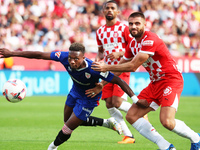 David Lopez and Alvaro Djalo play during the match between Girona FC and Athletic Club, corresponding to week 9 of LaLiga EA Sport, at the M...