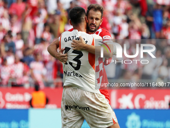 Paulo Gazzaniga and Cristhian Stuani celebrate during the match between Girona FC and Athletic Club in week 9 of LaLiga EA Sport at the Mont...