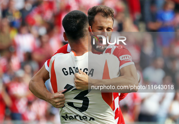 Paulo Gazzaniga and Cristhian Stuani celebrate during the match between Girona FC and Athletic Club in week 9 of LaLiga EA Sport at the Mont...