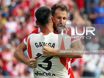 Paulo Gazzaniga and Cristhian Stuani celebrate during the match between Girona FC and Athletic Club in week 9 of LaLiga EA Sport at the Mont...