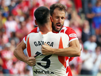 Paulo Gazzaniga and Cristhian Stuani celebrate during the match between Girona FC and Athletic Club in week 9 of LaLiga EA Sport at the Mont...