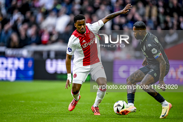 AFC Ajax Amsterdam defender Jorrel Hato and FC Groningen defender Leandro Bacuna play during the match between Ajax and Groningen at the Joh...