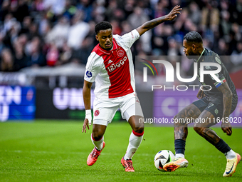 AFC Ajax Amsterdam defender Jorrel Hato and FC Groningen defender Leandro Bacuna play during the match between Ajax and Groningen at the Joh...