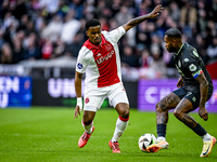 AFC Ajax Amsterdam defender Jorrel Hato and FC Groningen defender Leandro Bacuna play during the match between Ajax and Groningen at the Joh...