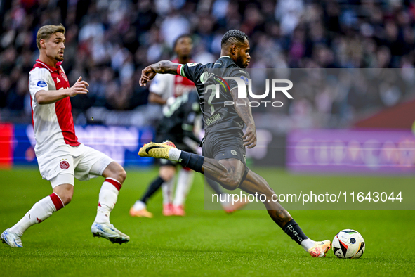 AFC Ajax Amsterdam midfielder Kenneth Taylor and FC Groningen defender Leandro Bacuna play during the match between Ajax and Groningen at th...