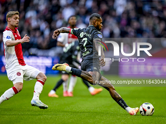 AFC Ajax Amsterdam midfielder Kenneth Taylor and FC Groningen defender Leandro Bacuna play during the match between Ajax and Groningen at th...