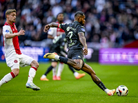 AFC Ajax Amsterdam midfielder Kenneth Taylor and FC Groningen defender Leandro Bacuna play during the match between Ajax and Groningen at th...