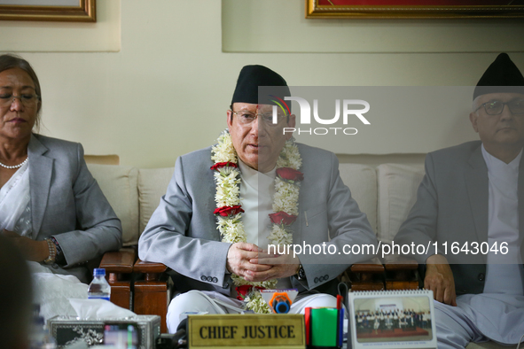 Nepal's new Chief Justice Prakashman Singh Raut (Center) addresses a press meet at the Supreme Court after taking charge of office in Kathma...