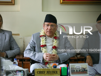 Nepal's new Chief Justice Prakashman Singh Raut (Center) addresses a press meet at the Supreme Court after taking charge of office in Kathma...