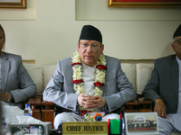 Nepal's new Chief Justice Prakashman Singh Raut (Center) addresses a press meet at the Supreme Court after taking charge of office in Kathma...