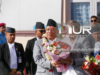 Nepal's new Chief Justice Prakashman Singh Raut (center) is welcomed by Supreme Court justices upon his arrival at the Supreme Court premise...