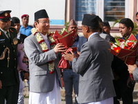 Nepal's new Chief Justice Prakashman Singh Raut (left in garland) is welcomed by Supreme Court justices and officials upon his arrival at th...