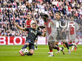 FC Groningen defender Marco Rente and AFC Ajax Amsterdam forward Brian Brobbey play during the match between Ajax and Groningen at the Johan...