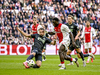 FC Groningen defender Marco Rente and AFC Ajax Amsterdam forward Brian Brobbey play during the match between Ajax and Groningen at the Johan...