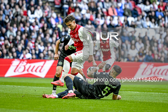 AFC Ajax Amsterdam forward Mika Godts and FC Groningen defender Marco Rente play during the match between Ajax and Groningen at the Johan Cr...