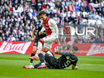 AFC Ajax Amsterdam forward Mika Godts and FC Groningen defender Marco Rente play during the match between Ajax and Groningen at the Johan Cr...