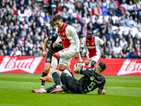 AFC Ajax Amsterdam forward Mika Godts and FC Groningen defender Marco Rente play during the match between Ajax and Groningen at the Johan Cr...