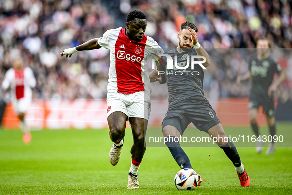 AFC Ajax Amsterdam forward Brian Brobbey and FC Groningen defender Marco Rente play during the match between Ajax and Groningen at the Johan...