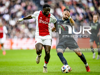 AFC Ajax Amsterdam forward Brian Brobbey and FC Groningen defender Marco Rente play during the match between Ajax and Groningen at the Johan...