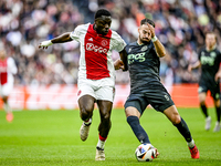 AFC Ajax Amsterdam forward Brian Brobbey and FC Groningen defender Marco Rente play during the match between Ajax and Groningen at the Johan...