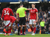 Ryan Yates of Nottingham Forest speaks with Referee Chris Kavanagh during the Premier League match between Chelsea and Nottingham Forest at...