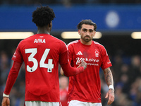 Ola Aina of Nottingham Forest and Jota Silva of Nottingham Forest shake hands during the Premier League match between Chelsea and Nottingham...