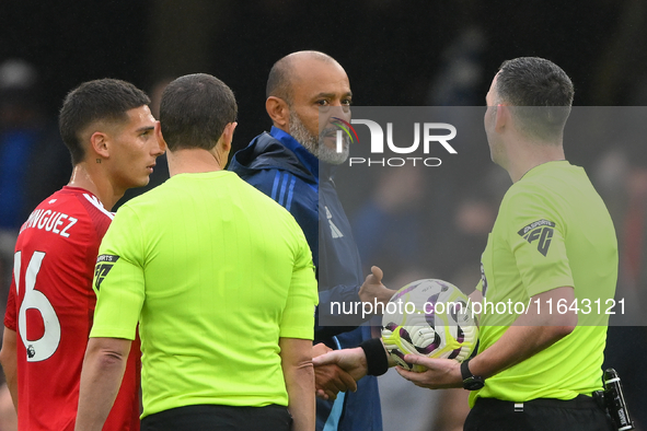 Nuno Espirito Santo, Nottingham Forest head coach, speaks with Referee Chris Kavanagh during the Premier League match between Chelsea and No...