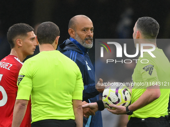 Nuno Espirito Santo, Nottingham Forest head coach, speaks with Referee Chris Kavanagh during the Premier League match between Chelsea and No...