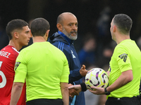 Nuno Espirito Santo, Nottingham Forest head coach, speaks with Referee Chris Kavanagh during the Premier League match between Chelsea and No...