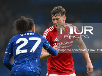 Ryan Yates of Nottingham Forest shakes hands with Malo Gusto of Chelsea after the final whistle during the Premier League match between Chel...