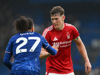 Ryan Yates of Nottingham Forest shakes hands with Malo Gusto of Chelsea after the final whistle during the Premier League match between Chel...