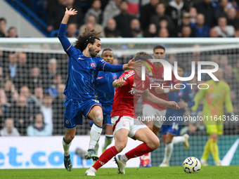 Ryan Yates of Nottingham Forest is under pressure from Marc Cucurella of Chelsea during the Premier League match between Chelsea and Notting...