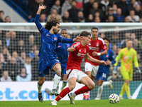 Ryan Yates of Nottingham Forest is under pressure from Marc Cucurella of Chelsea during the Premier League match between Chelsea and Notting...