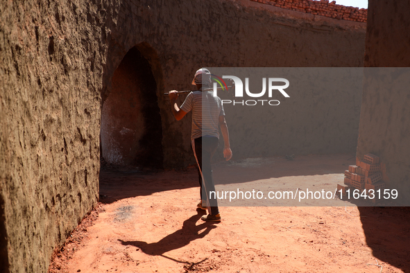 Red brick factory workers in Fayoum, Egypt, on October 5, 2024. 