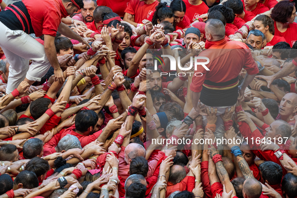 Members of the colla Nens del Vendrell build a human tower during the Concurs de Castells competition in Tarragona, Spain, on October 6, 202...