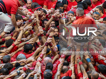 Members of the colla Nens del Vendrell build a human tower during the Concurs de Castells competition in Tarragona, Spain, on October 6, 202...