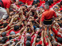 Members of the colla Nens del Vendrell build a human tower during the Concurs de Castells competition in Tarragona, Spain, on October 6, 202...