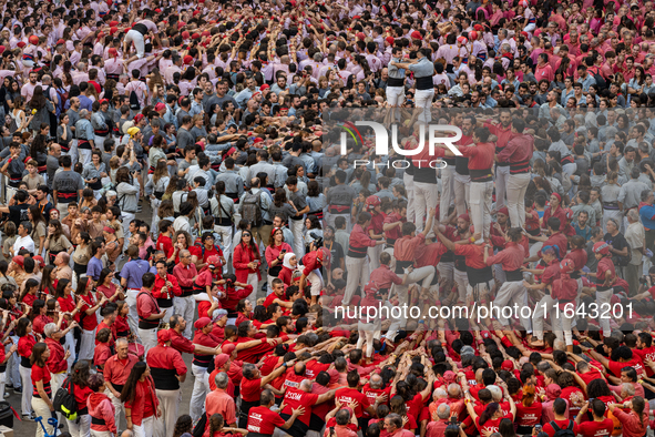 Members of the colla Nens del Vendrell build a human tower during the Concurs de Castells competition in Tarragona, Spain, on October 6, 202...